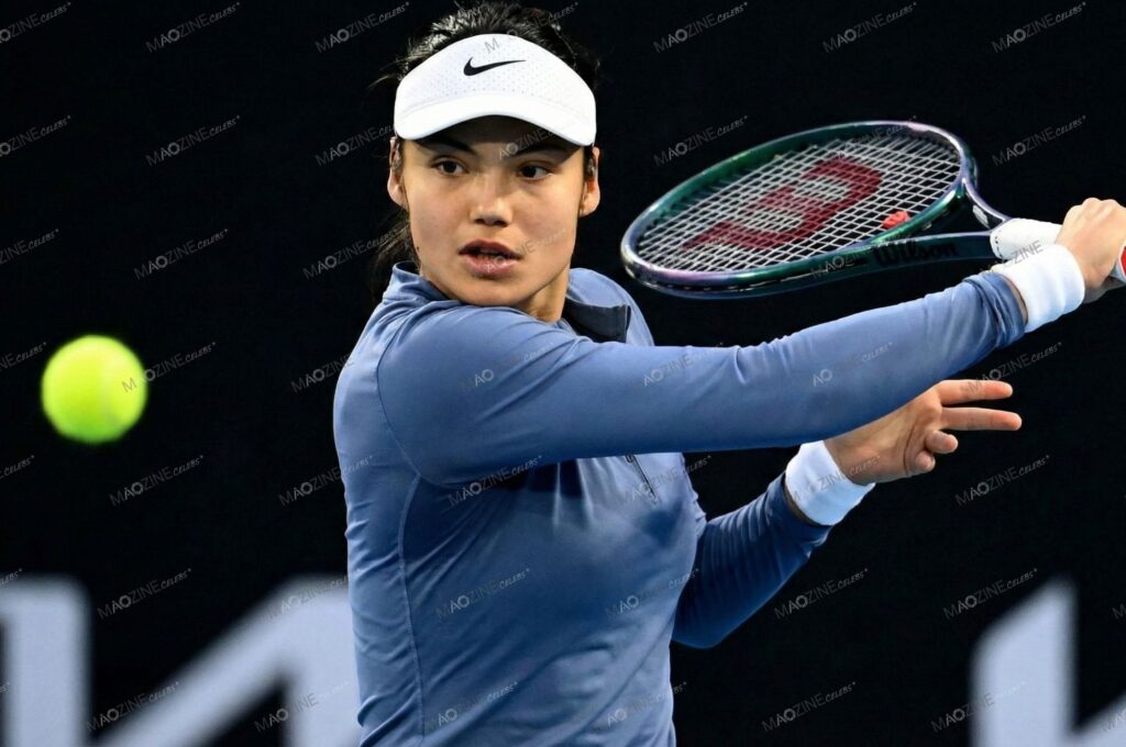 Emma Raducanu hitting a forehand in a blue outfit using her Wilson Blade racquet during the Australian Open.