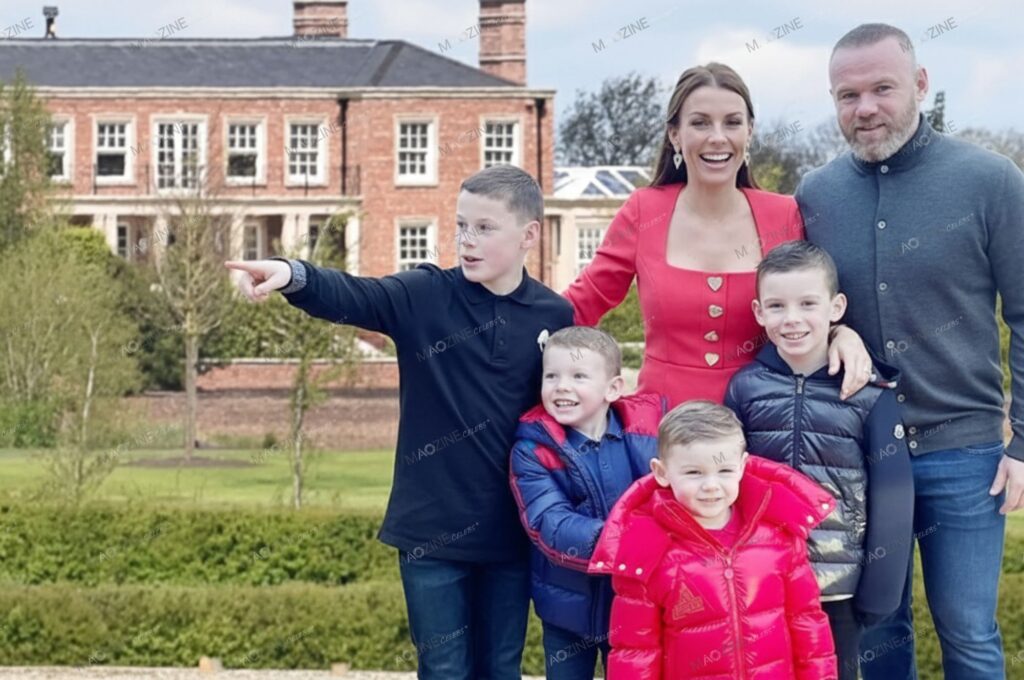 Wayne Rooney and Coleen Rooney with their four sons Kai, Klay, Kit, and Cass standing in front of their lavish £20 million Cheshire home.