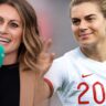 Karen Carney smiling pitch-side in 2025, wearing broadcaster headset