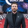 Chris Evans on red carpet at GALPALA 2025 event in dark suit, smiling before photographers