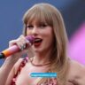 Concept art for Taylor Swift’s 2025 album The Life of a Showgirl, featuring symbolic stage lights and a showgirl theme.