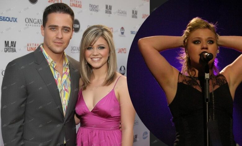 Jason Clarkson (in a gray suit) stands next to his sister, singer Kelly Clarkson (in a pink dress) on a red carpet, with a background image showing Kelly performing live on stage.