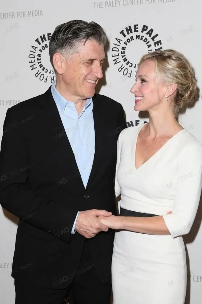 Craig Ferguson holding hands with his current wife, Megan Wallace Cunningham, who is wearing a white dress.