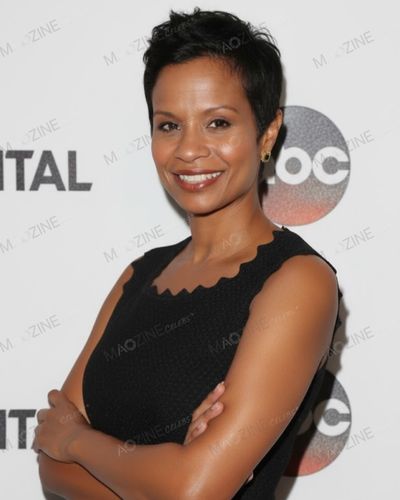 A professional portrait of Keisha Chambers (wife of Justin Chambers) smiling at an ABC television event, wearing a black dress.