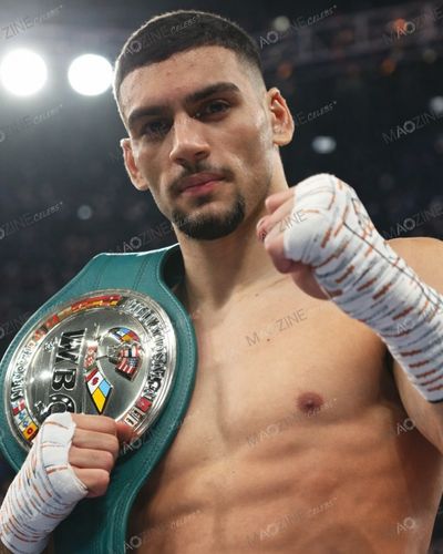 Hamzah Sheeraz posing with his WBC Silver Middleweight Championship belt after a victory.