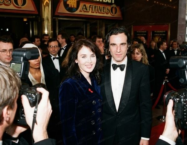 Isabelle Adjani and Daniel Day-Lewis posing together on the red carpet during their relationship in the 1990s