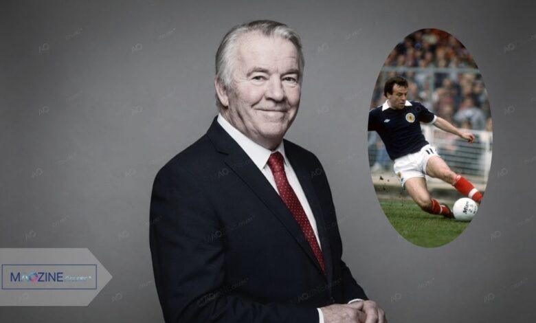 John Robertson Nottingham Forest legend tribute image features a recent portrait of him in a suit and red tie, alongside an inset photo of him playing for Scotland in a blue kit, scoring a goal.