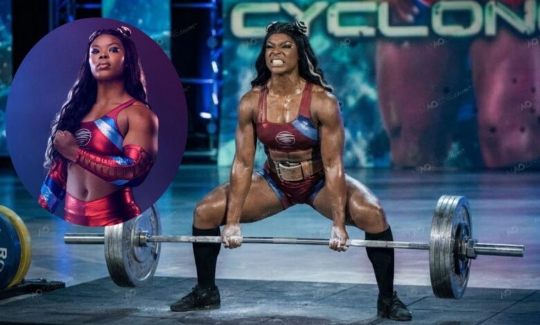 Lystus Ebosele as Cyclone from BBC Gladiators performing a heavy deadlift and posing in official costume.