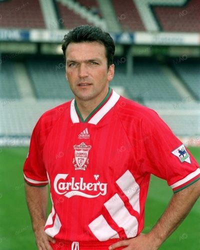 Young Neil Razor Ruddock posing in red Liverpool FC football kit during his professional career as a defender.