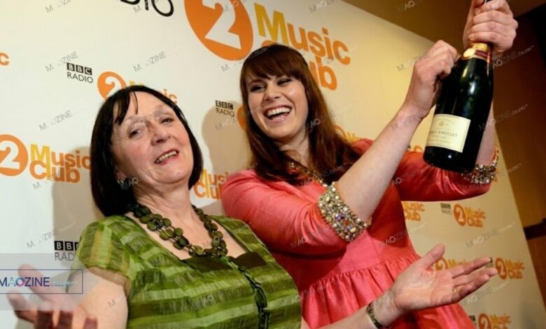 Marie Nash smiling alongside her daughter, singer-songwriter Kate Nash, at a music event.
