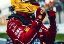 Lewis Hamilton biography- He is wearing biker dress and helmet.